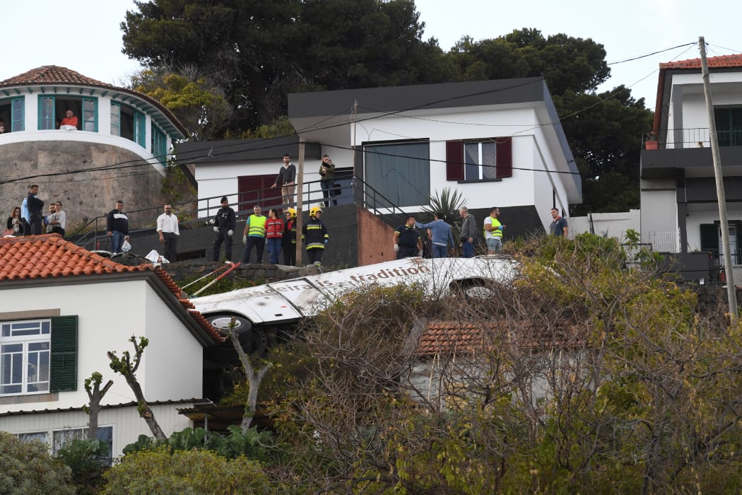The wreckage of the tourist bus that crashed in Caniço, on the Portuguese island of Madeira.