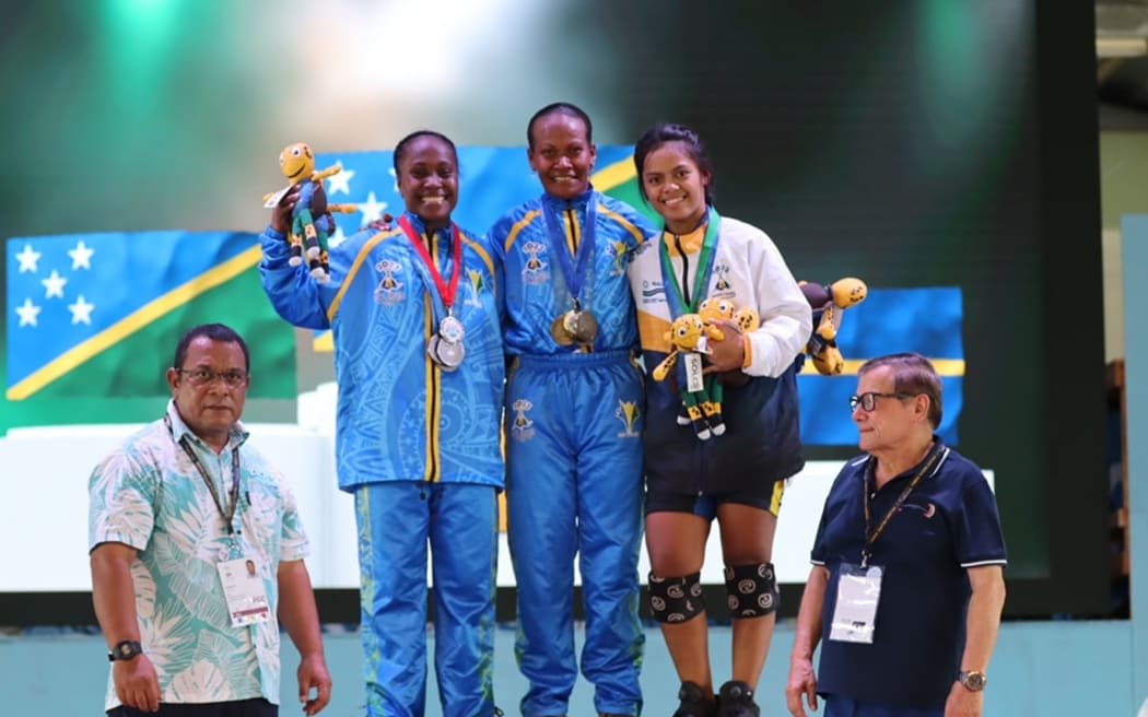 Jenlyn Wini (midle) flanked by silver medallist Lora Maelosia of the Solomons and Nauru's My-Only Stephens who claimed bronze. Photo: Team Nauru
