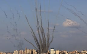 A salvo of rockets is fired by Palestinian militants from Gaza towards Israel on 10 October, 2023. Israel said it recaptured Gaza border areas from Hamas on 10 October, 2023.