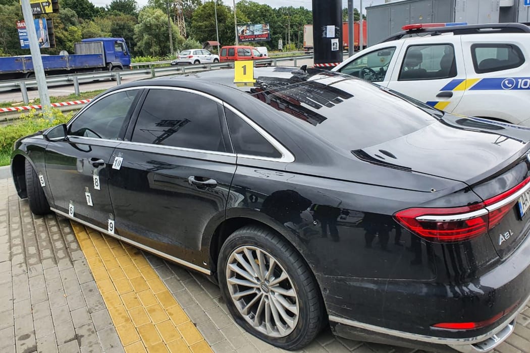 A handout photograph taken and released on September 22, 2021 by the Ukrainian Interior Ministry press office shows the bullet impacts on the car of Ukrainian President's Chief Aide Sergei Shefir, in Kiev.