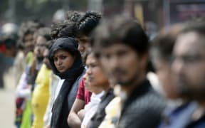 Bangladeshi social activists form a human chain during a protest against the killing of US blogger of Bangladeshi origin, Avijit Roy.