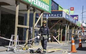 Shops on the main street in Kaikoura have structural work done on them.