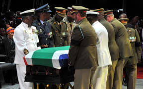 South Africa's first black president was laid to rest after a state funeral.