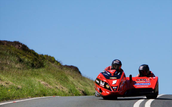 A sidecar team at the Isle of Man TT.