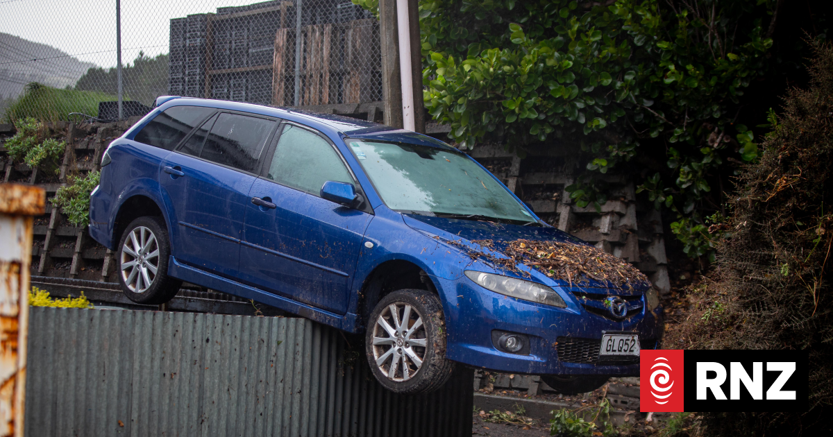 Wellington man 'dumbstruck' to find car on fence after flood