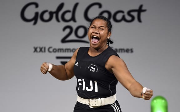 Eileen Cikamatana celebrates on her way to winning gold in the women's 90kg weightlifting final at the 2018 Gold Coast Commonwealth Games.