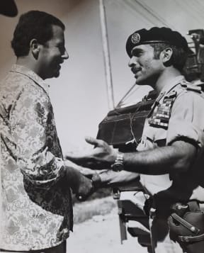 Tuma and the late King Hussein of Jordan, standing on top of a tank, 1967