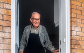 elderly man at door