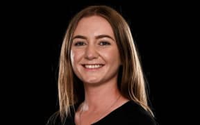 New Zealand lawn bowler Selina Goddard smiles in front of a black background