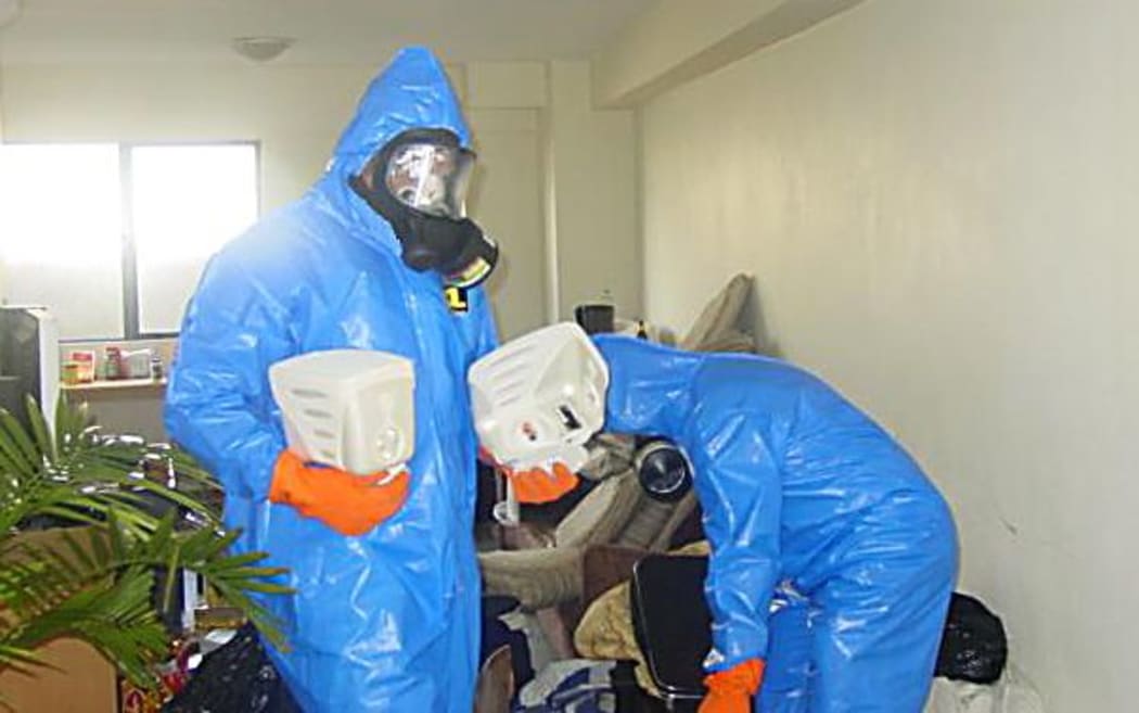 Workers at a contaminated site.