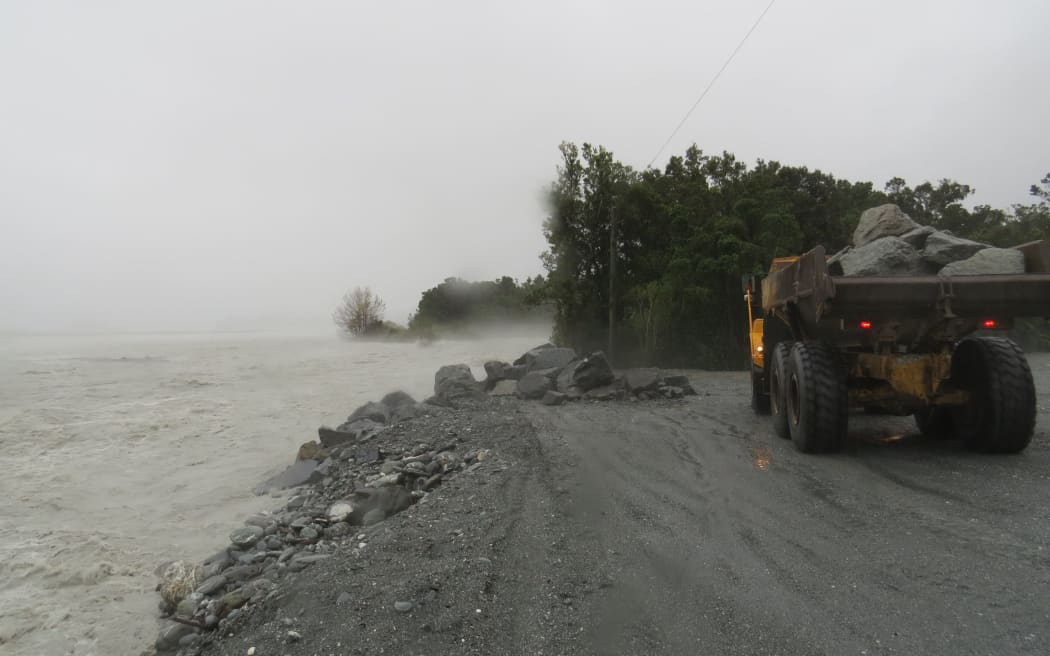 The Waiho River in flood, washing through the end of the NZ Transport Agency stopbank immediately behind the Scenic Group hotel site at Franz Josef, on March 23, 2016.