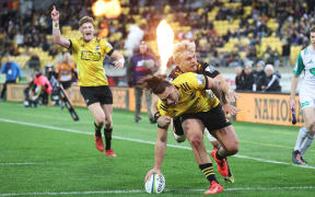 Hurricanes player Peter Umaga-Jensen scores a try