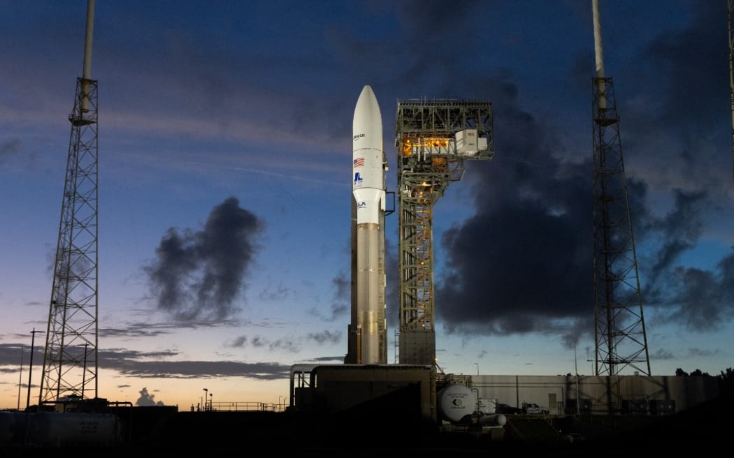 This handout photo provided by United Launch Alliance on October 6, 2023, shows the United Launch Alliance (ULA) Atlas V rocket and Amazon's Project Kuiper Protoflight mission sitting on the pad at Space Launch Complex 41 (SLC-41) in Cape Canaveral, Florida, on October 5, 2023. Amazon is set to launch two satellites on October 6, 2023, in its first test mission as part of its plan to deliver the internet from space and compete with Elon Musk’s Starlink service. Once up and running, the company founded by Jeff Bezos says its Project Kuiper will provide "fast, affordable broadband to unserved and underserved communities around the world," with a constellation of more than 3,200 satellites in low Earth orbit (LEO). (Photo by Handout / United launch Alliance / AFP) / RESTRICTED TO EDITORIAL USE - MANDATORY CREDIT "AFP PHOTO / United Launch Alliance" - NO MARKETING NO ADVERTISING CAMPAIGNS - DISTRIBUTED AS A SERVICE TO CLIENTS