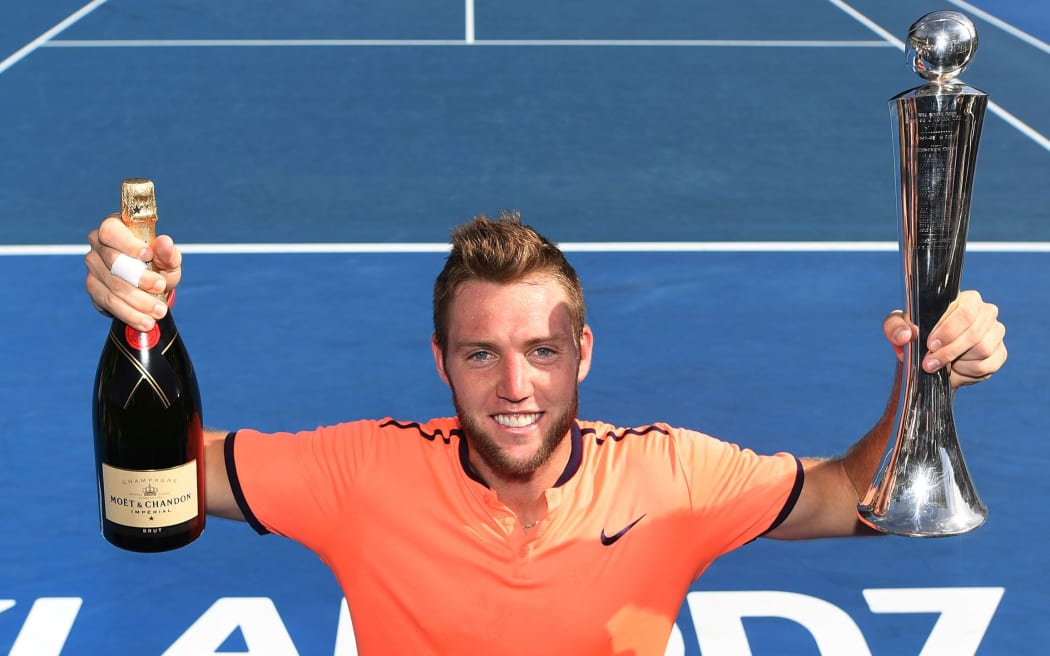 Jack Sock displays the ASB Classic trophy.