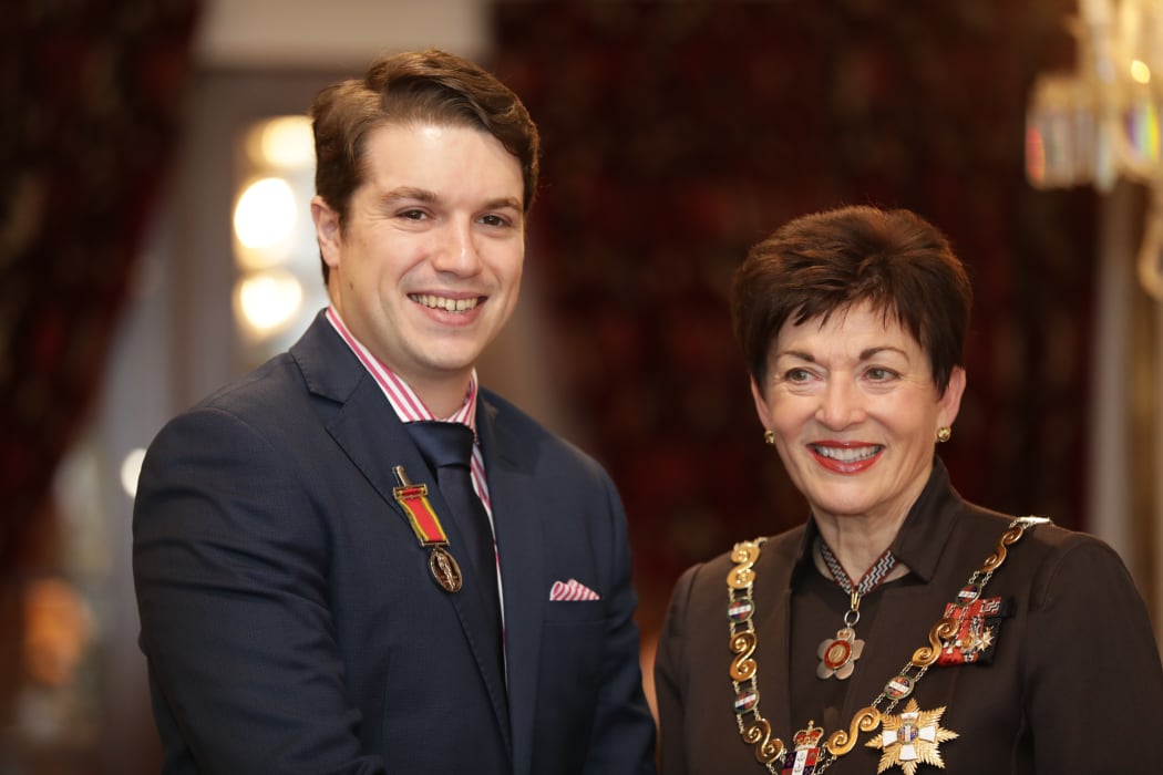 Royal Humane Society of New Zealand Presentation Ceremony. Dr Rory Clarke recieves his medal from Dame Patsy Reddy.