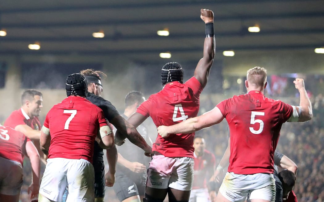 Lions players celebrate scoring a penalty try.