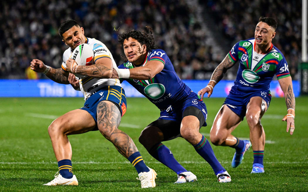 Jake Tago of the Parramatta Eels, Dallin Watene-Zelezniak of the Warriors and Charnze Nicoll-Klokstad of the Warriors. One NZ Warriors v Parramatta Eels, round 22 rugby league match of the Telstra NRL Premiership at Go Media Stadium, Mt Smart, Auckland, New Zealand on Friday 2 August 2024. © Photo: Andrew Cornaga / Photosport