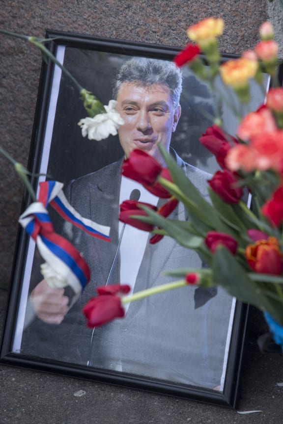 Flowers are placed at the ceremony marking  Boris Nemtsov's death.