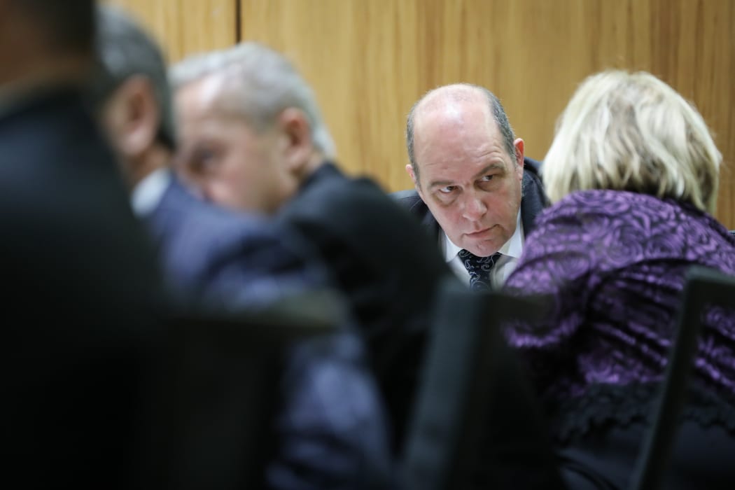 Brett Hudson confers with Judith Collins about the Arms Legislation Bill