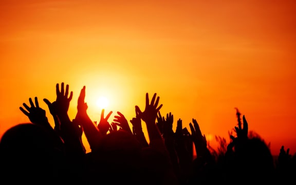crowd with hands in the air