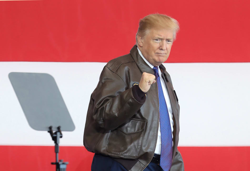 Donald Trump arrives at the US Yokota Air Base in Tokyo