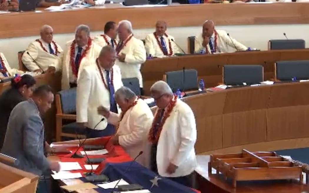 Leader of the HRPP, Tuilaepa Dr Sailele Malielegaoi, leads the swearing in of HRPP MPs in Parliament