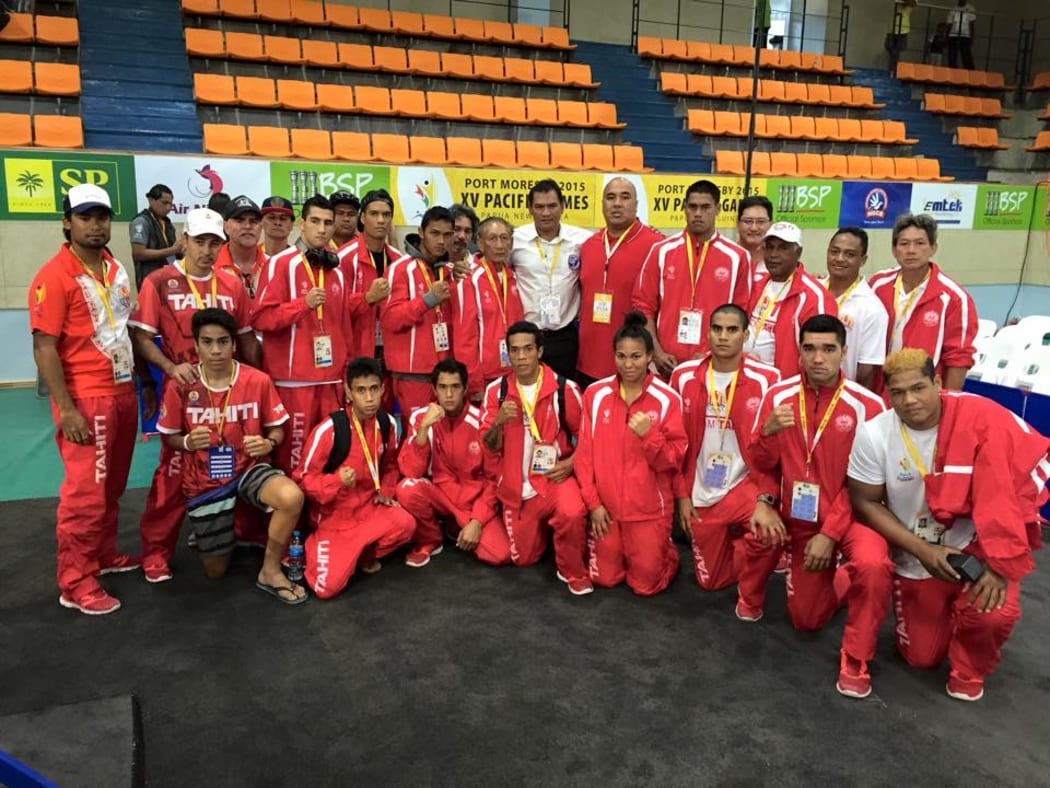Tahiti's boxers at the 2015 Pacific Games in Port Moresby pictured with 1996 Olympic silver medallist Paea Wolfgramm.