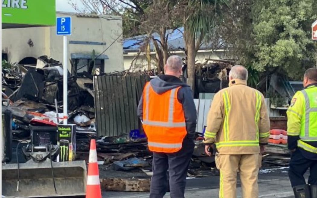 A Frederick St home surrounded by piles of hoarded goods went up in flames in Hastings on Saturday morning.