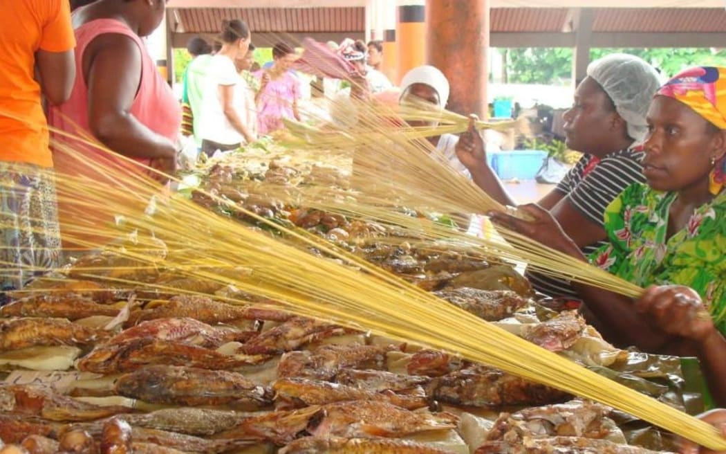 Dried fish sellers at Vanuatu food market
