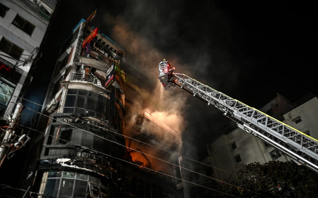 Firefighters work to extinguish a fire in a commercial building that killed at least 43 people, in Dhaka, on February 29, 2024. At least 43 people were killed and dozens injured after a fire blazed through a seven-storey building in an upscale neighbourhood in the Bangladeshi capital of Dhaka late on February 29, health authorities said. (Photo by Munir Uz Zaman / AFP)
