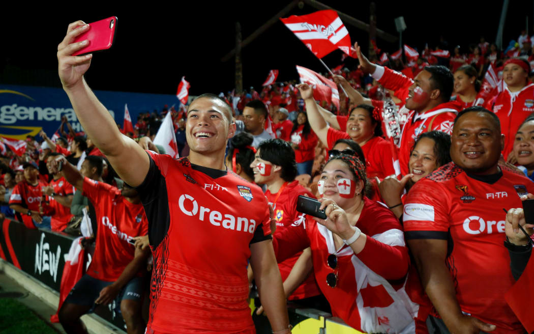 Tonga's Tuimoala Lolohea is all smiles with fans after beating Samoa.