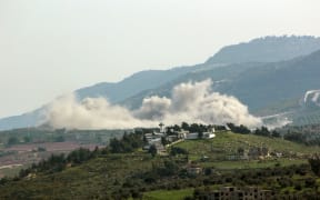 Smoke billows during Israeli bombardment on the village of Kfarkila in southern Lebanon near the border with Israel on 26 March 2024, amid ongoing cross-border tensions as fighting continues between Israel and Hamas militants in the Gaza Strip. (Photo by RABIH DAHER / AFP)