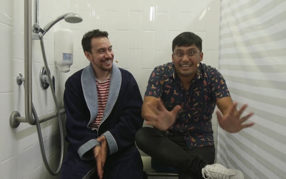 Comedian David Correos with host James Nokise.