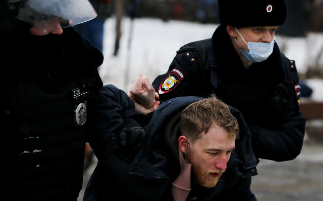 MOSCOW, RUSSIA - JANUARY 23: Police take a protester into custody during a protest demanding the release of Russian opposition leader Alexei Navalny in Moscow, Russia on January 23, 2021.