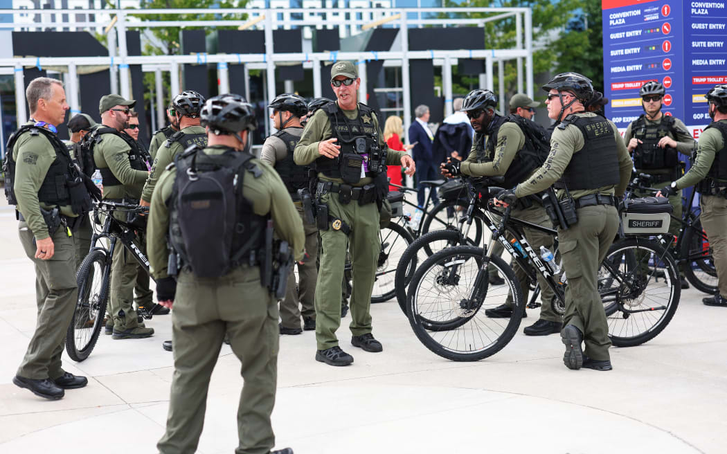 MILWAUKEE, WISCONSIN - JULY 14: Law Enforcement Officers from Palm Beach hang out in the Fiserv Forum Plaza ahead of the 2024 Republican National Convention (RNC) on July 14, 2024 in Milwaukee, Wisconsin. Law enforcement officials began final preparations on the eve of RNC where Republican presidential candidate former President Donald Trump is expected to formally receive the GOP nomination for the 2024 U.S. Presidential election. Trump suffered minor injuries during a campaign rally on on July 13 in Butler, Pennsylvania after a gunman opened fired killing one person and injuring two critically.   Michael M. Santiago/Getty Images/AFP (Photo by Michael M. Santiago / GETTY IMAGES NORTH AMERICA / Getty Images via AFP)