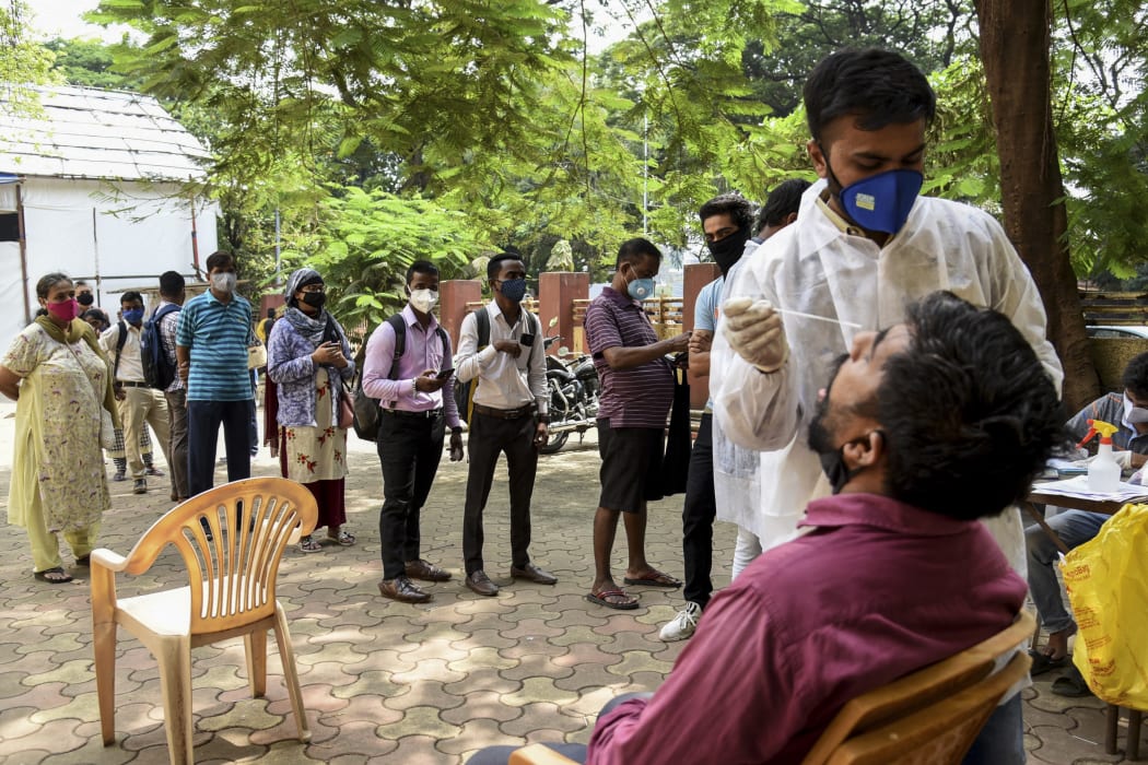 India surged past 13 million coronavirus cases.
