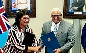 Fiji Prime Minister, Frank Bainimarama, and NZ Foreign Affairs Minister, Nanaia Mahuta, shake hands after signing the Duavata Partnership agreement in Suva, Fiji. 29 March 2022
