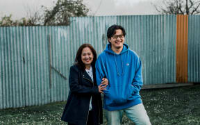 (L-R) Grace Trinidad and her son Joseph in their backyard in Waipawa, Hawke's Bay.