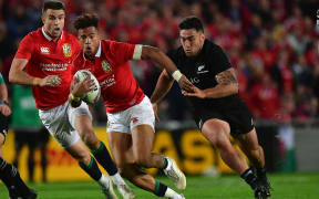 Lion's Anthony Watson is tackled by All Blacks Codie Taylor during the All Blacks vs British and Irish Lions at Eden Park.