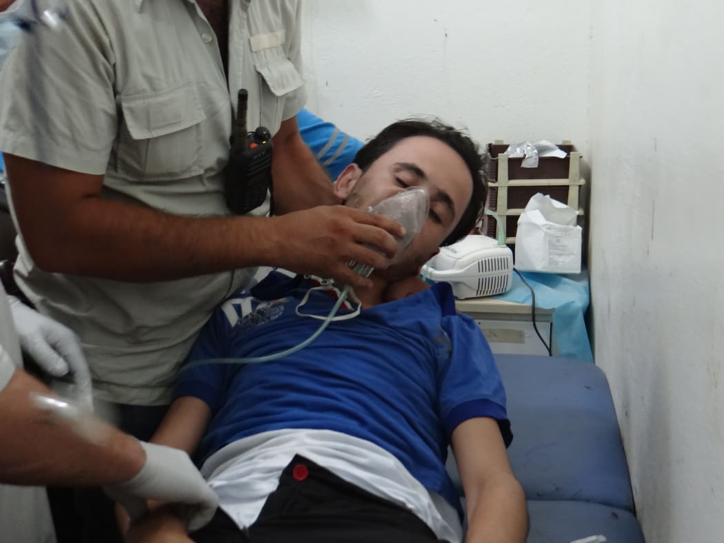 A man receives treatment after a suspected gas attack on the Syrian town of Saraqeb earlier in August.