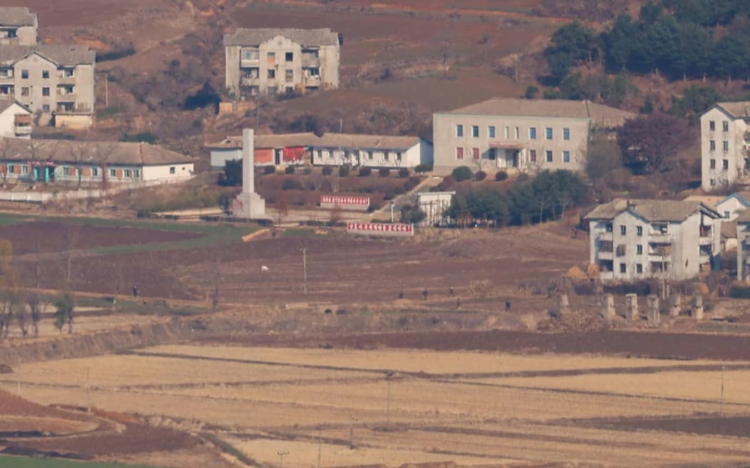 North Korean citizens walk in Kaepung, in this picture taken from the top of the Aegibong Peak Observatory.