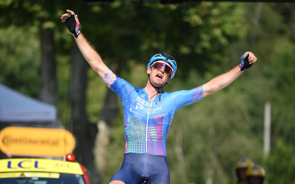 Canadian Hugo Houle of Israel-Premier Tech celebrates as he crosses the finish line to win stage sixteen of the 2022 Tour de France