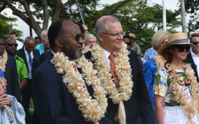 Scott Morrison with Charlot Salwai (left) during his visit to Vanuatu