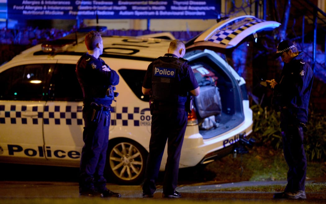 Police staying on the alert during the siege in the Melbourne bayside suburb of Brighton during the siege.