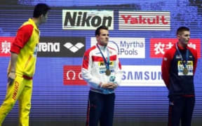 Chinese swimmer Sun Yang has words with Briton Duncan Scott after extraordinary scenes following the 200m freestyle final at the world champs in Gwangju.
