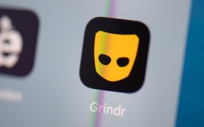 This illustration picture taken on July 24, 2019 in Paris shows the logo of the US social networking application Grindr on the screen of a tablet. (Photo by Martin BUREAU / AFP)