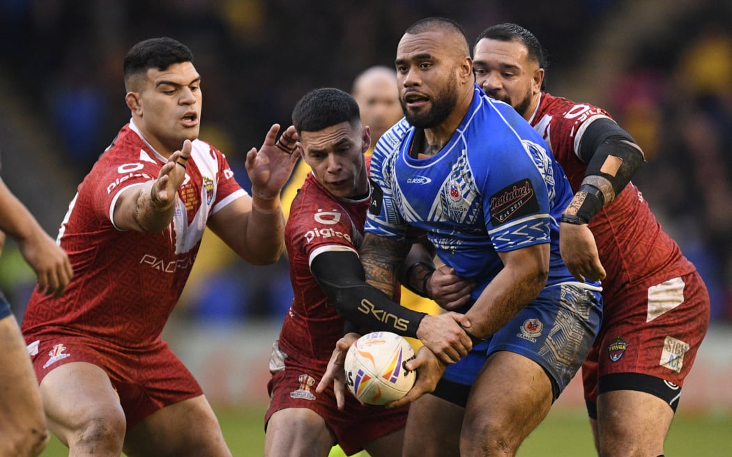 Samoa's Junior Paulo looks to offload during the rugby league World Cup men's quarter-final against and Samoa on November 6.