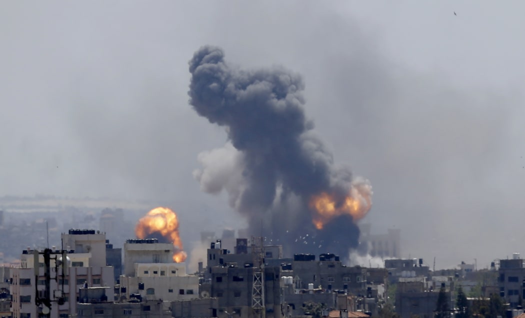 Smoke rises from an explosion caused by an Israeli airstrike in Gaza City, Saturday, May 4, 2019.