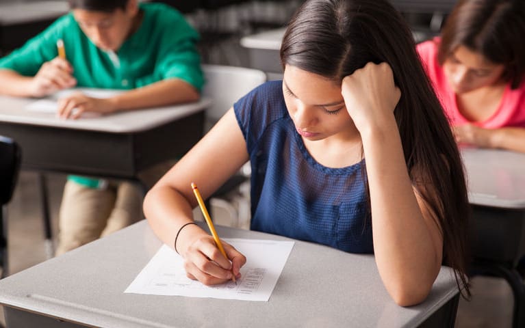 High school students working in a classroom.