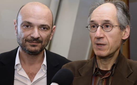 'Charlie Hebdo' editor-in-chief Gerard Briard (R) and lawyer Richard Malka (L) at the headquarters of French newspaper 'Liberation' on 9 January.